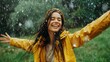 © Oulaphone - Happy woman enjoying with rain in nature with her arms outstretched to embrace nature.