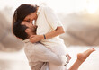 © peopleimages.com - Love, carry and couple at beach with hug on vacation, adventure and holiday for valentines day. Sunset, happy and man with embrace for bonding, together and woman by ocean for romantic trip on island