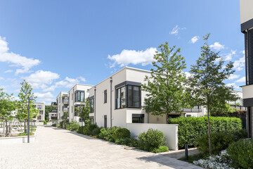 Wall Mural - Residential area with ecological and sustainable green residential buildings, low-energy houses with apartments and green courtyard