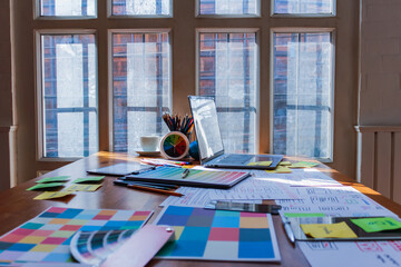 Wall Mural - mobile application development team is studying and designing ux ui system to display and color in a
