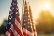 © VISUAL BACKGROUND - A close up of american flags in the sun.