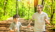 © Louis-Paul Photo - A father and son exercising and jogging together at an outdoor park having great fun