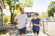 © Louis-Paul Photo - family and daughter exercising and jogging together at an outdoor park having great fun