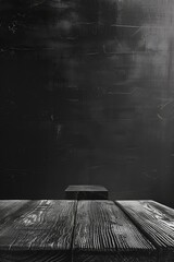 Wall Mural - A wooden table with a black background. Scene is somber and quiet