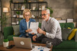 © Miljan Živković - Mature man and woman work form home have consultation via video call