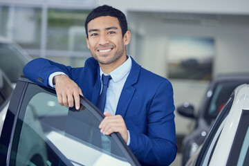 Canvas Print - Car, showroom and portrait of man with smile for automobile, job and confidence in career. Transportation, door and salesman with pride in dealership for happiness, business and consultant by vehicle