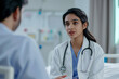 © Ирина Щукина - A woman doctor is talking to a man in a white coat. Indian doctor, nurse and medical student. College and university