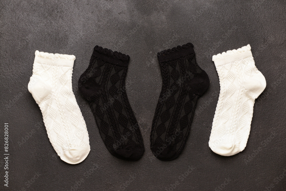 Basic color socks on black grunge background