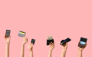 Poster - Female hands with credit cards, wallet, calculator and payment terminal on pink background