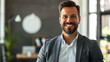 © Ali - portrait of a happy male entrepreneur in modern office, smiling man working in office