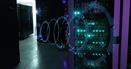 Canvas Print - Image of moving circles forming tunnel over illuminated server room in background