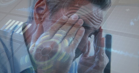 Wall Mural - Image of interface with data processing against close up of a caucasian senior man at office