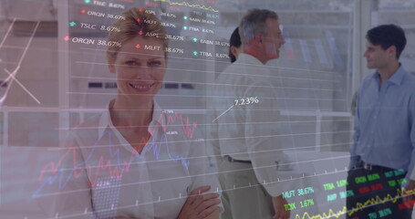 Canvas Print - Image of stock market data processing over portrait of caucasian businesswoman smiling at office