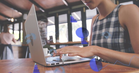 Poster - Image of graphs and globes over low angle view of biracial woman working on laptop