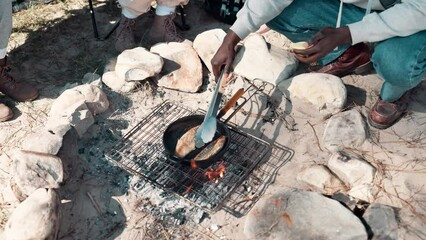 Poster - Camping, hand and cooking with pot on fire for fish breakfast, hungry or nutrition meal in nature. Travel, campsite and person with utensil for fishing trip, weekend break or adventure in forest