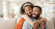 © peopleimages.com - Father, child and happy hug in home or morning bonding in apartment for trust, love or connection. Man, daughter and embrace on living room sofa for safety comfort or parent cuddle, family or smile