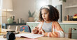 © peopleimages.com - Little girl, thinking and counting with book in kitchen for mathematics, homework or assessment at home. Young female person, child or kid in wonder or thought with addition or numbers at house