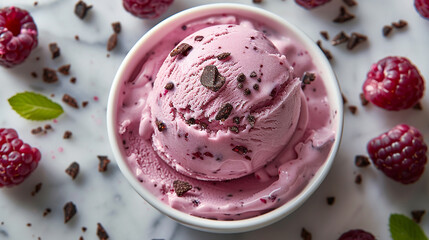 Wide banner photo of delicious scoop of purple color black raspberry chip cookie dough ice cream sorbet on a icecream cup with fruits and chips around in white background 