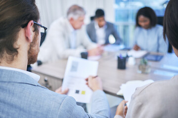 Canvas Print - Back, business man and documents for presentation, seminar and workshop at desk in office. Teamwork, collaboration and trade show or meeting in conference room for international company in New York