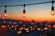 © Alexander - a string of lights with a city in the background