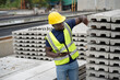 © chachamp - Portrait African engineer man working at precast cement outdoor factory