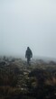 © liliyabatyrova - A man is walking through a foggy field
