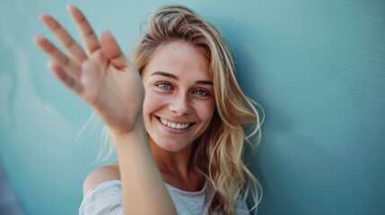 The woman waving happily