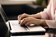 © alisaaa - closeup cropped image student girl hands typing using laptop