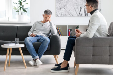 Wall Mural - Professional psychotherapist working with patient in office