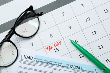 Wall Mural - Tax day. Calendar with date reminder, document, pen and glasses on table, flat lay