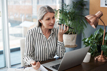 Poster - Business woman, laptop and voice call for communication, planning or network in public relations. Professional and mature worker talking on mobile or phone for contact with online clients in office