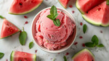 Wide banner photo of delicious scoop of watermelon ice cream sorbet on a icecream cup with fruit pieces around in white background