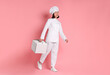 © New Africa - Happy confectioner with cake box on pink background