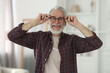 © New Africa - Portrait of happy grandpa with glasses indoors
