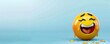 © Nasreen - crying with laughter emoji on a light blue background with space for copy The emoji is bright yellow with tears of joy