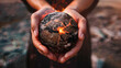 © Dmitriy - A person holds a burning earth in their hands, symbolizing the destruction caused by nuclear tests, banner, poster