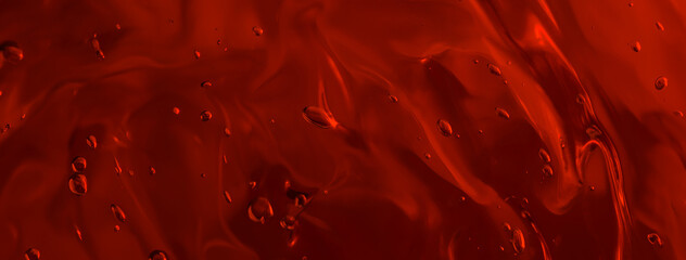 Long banner. Close up gel texture of cosmetic products. red abstract background with bubbles. macro photo. blur and selective focus.