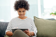 © peopleimages.com - Business, tablet and black woman in office with internet research, reading article and virtual consultation. Telehealth, tech and African female therapist on couch for mental health with psychology