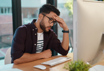 Wall Mural - Computer, copywriter and man with headache, frustrated and burnout in office in stressed or tired. Creative, person and technology in online, digital and website for deadline, due date on project