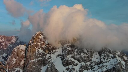 Wall Mural - Aerial view of high mountains and clouds in the Triglav National Park at sunset, Julian Alps, Slovenia, 4k