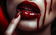 © bluebeat76 - Sensual red glossy lips with blood dripping down