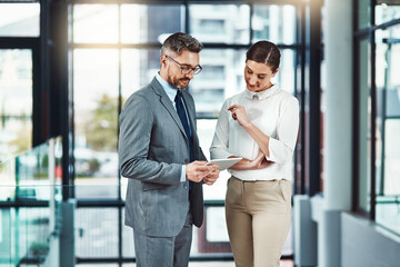 Aufkleber - Mature, businessman and woman with tablet for feedback, guidance and planning project in office. Corporate team, meeting and mentor with tech for advice and criticism on company proposal in boardroom
