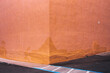 © Andrew Kornylak - The pinkish-orange painted outside corner of a building in Pacifica, California