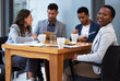 © peopleimages.com - Office, business and colleagues in portrait for lunch, breakfast and beverage or tea break. Workplace, cafeteria and food for corporate people, men and women with conversation or catch up on table