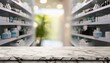 © Seema - person in a pharmacy,  an empty marble table counter with medicines healthcare product arranged on shelves in drugstore blurred defocused background wallpaper Pharmacy