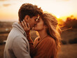 © Llama-World-studio - Sunset casts a warm glow as young couple shares a kiss