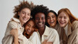 © deimos.az - Photo of five diverse smiling people symbolizing diversity, inclusion, and friendship between colleagues in the workplace environment.