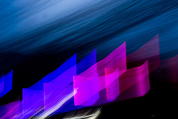 Wall Mural - a blurry, colorful depiction of a blue and purple wave. the colors are vibrant and the wave appears 
