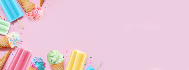 Wall Mural - Collection of colorful pastel summer ice cream cones and popsicle frozen desserts. Overhead view corner border on a pink banner background. Copy space.