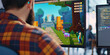 © Lila Patel - A game developer codes a thrilling level for their new game, their imagination the only limit to what they can create